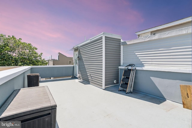 view of patio terrace at dusk