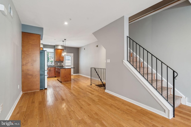 unfurnished living room featuring light hardwood / wood-style flooring