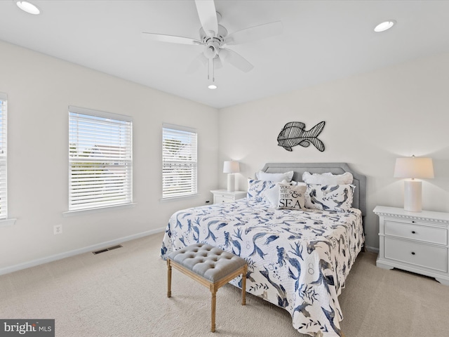 carpeted bedroom with ceiling fan