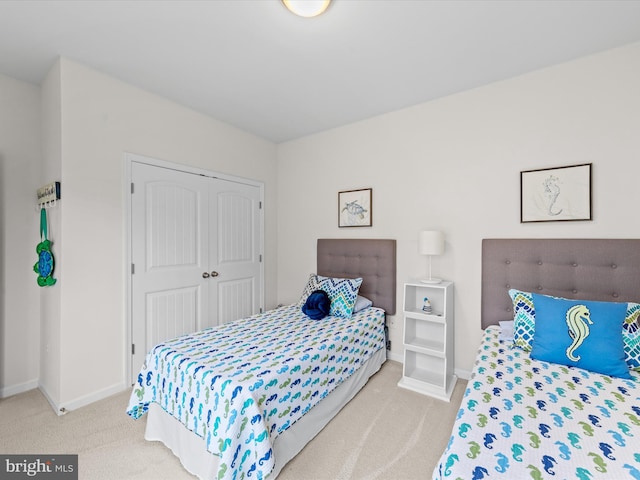 bedroom with carpet floors and a closet