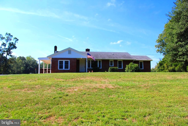 ranch-style house featuring a front yard