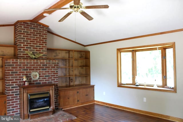 unfurnished living room featuring ornamental molding, ceiling fan, dark hardwood / wood-style floors, vaulted ceiling with beams, and a brick fireplace