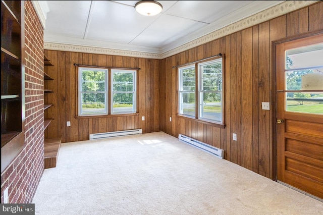 foyer featuring carpet flooring, a baseboard radiator, and wood walls