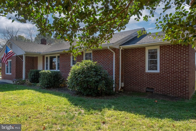 view of property exterior with a yard