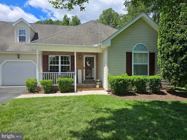 910 Sapphire Ct, Salisbury, MD 21804 - view of front of property featuring covered porch, roof with shingles, an attached garage, and a front yard