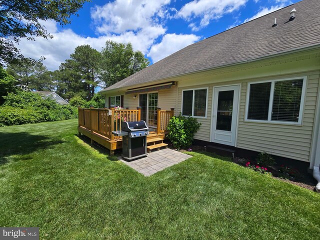 910 Sapphire Ct, Salisbury, MD 21804 - back of property with a shingled roof, a wooden deck, and a lawn