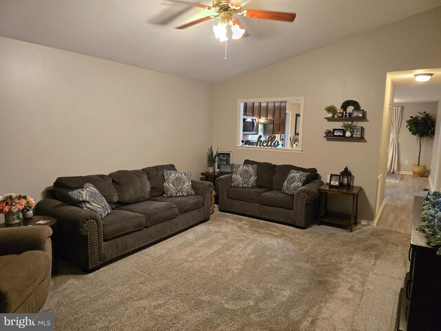 910 Sapphire Ct, Salisbury, MD 21804 - living room featuring a ceiling fan, lofted ceiling, carpet flooring, and baseboards