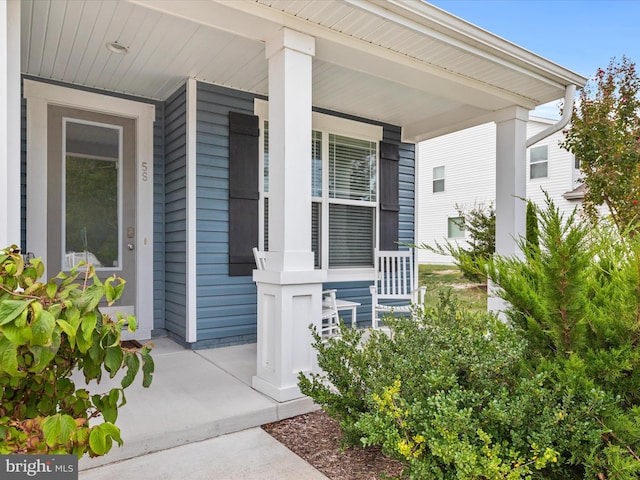 property entrance with covered porch