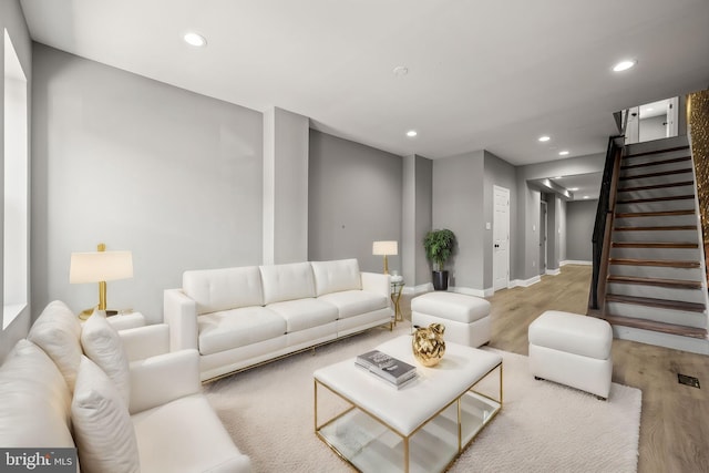1933 E Somerset St, Philadelphia, PA 19134 - living area featuring recessed lighting, light wood finished floors, stairway, and baseboards