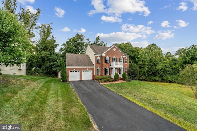 colonial house with a garage and a front lawn