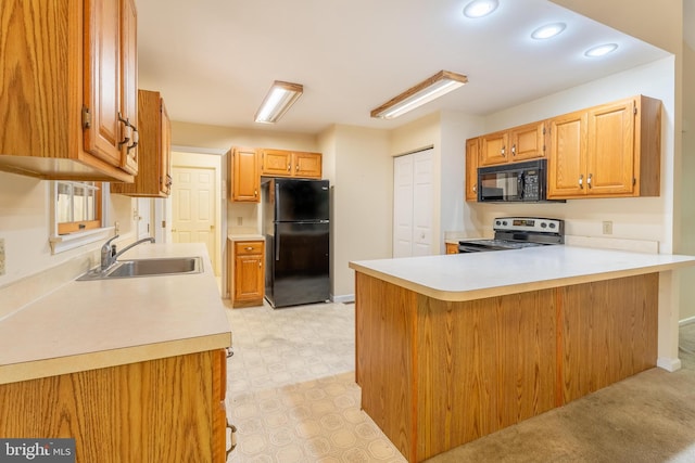 kitchen featuring black appliances, kitchen peninsula, sink, and light carpet