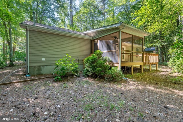 back of house featuring a sunroom