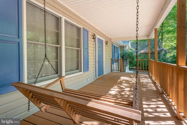 wooden deck featuring a porch