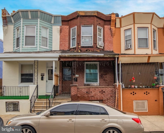 multi unit property featuring cooling unit and a porch