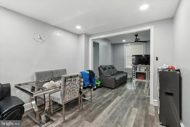 dining space featuring ceiling fan and hardwood / wood-style flooring