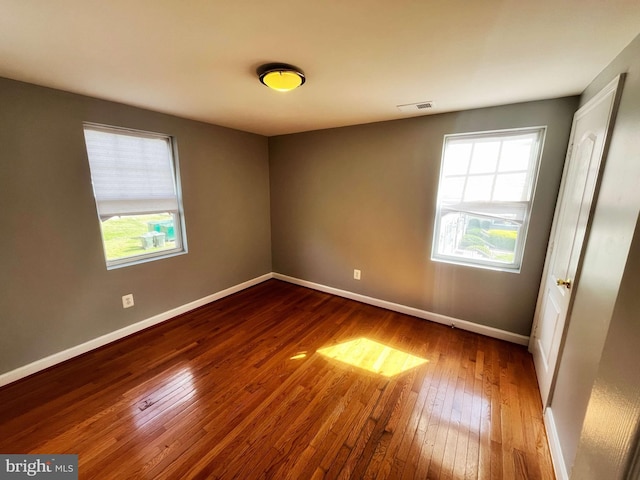 empty room featuring hardwood / wood-style flooring