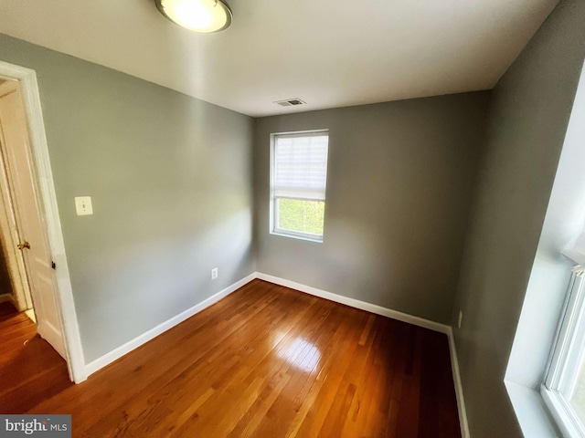 spare room featuring hardwood / wood-style flooring