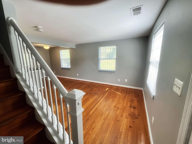 staircase featuring hardwood / wood-style floors