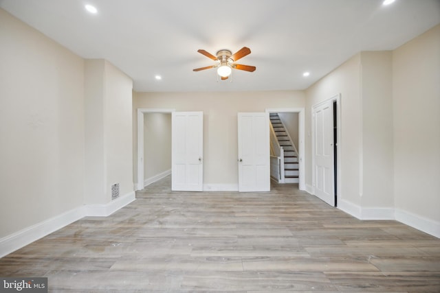 spare room with ceiling fan and light hardwood / wood-style flooring