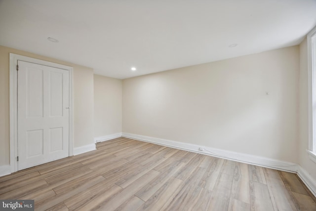 unfurnished room with light hardwood / wood-style flooring