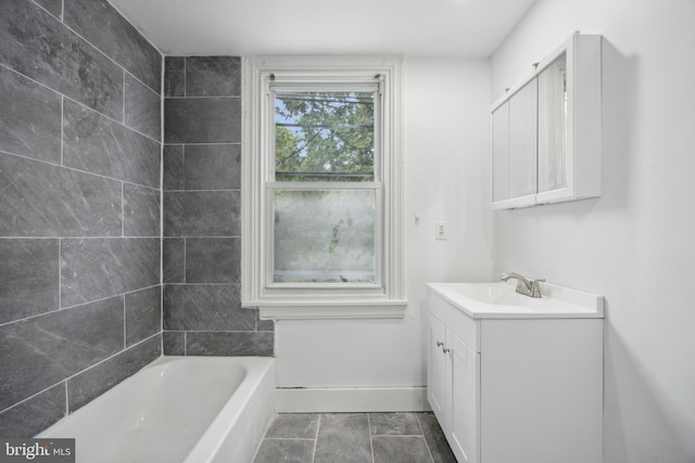 bathroom featuring vanity and a tub to relax in