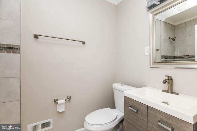 919 N Lakewood Ave, Baltimore, MD 21205 - full bathroom featuring visible vents, toilet, ornamental molding, and vanity