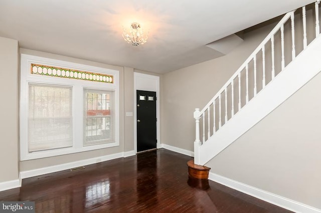 919 N Lakewood Ave, Baltimore, MD 21205 - foyer featuring baseboards, wood finished floors, an inviting chandelier, and stairway