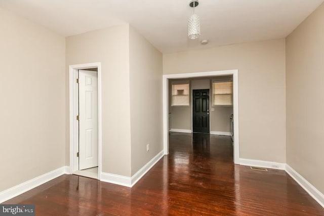 919 N Lakewood Ave, Baltimore, MD 21205 - empty room featuring baseboards and wood finished floors