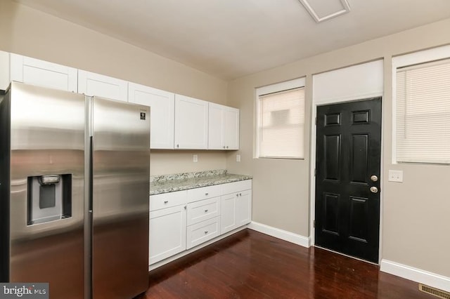 919 N Lakewood Ave, Baltimore, MD 21205 - kitchen featuring white cabinetry, stainless steel fridge with ice dispenser, baseboards, dark wood finished floors, and visible vents