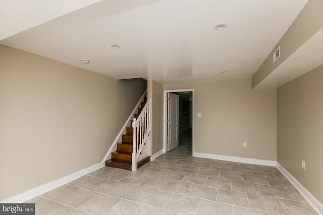 919 N Lakewood Ave, Baltimore, MD 21205 - below grade area featuring baseboards, stairway, and visible vents