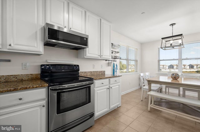 kitchen with light tile patterned flooring, an inviting chandelier, pendant lighting, appliances with stainless steel finishes, and white cabinetry