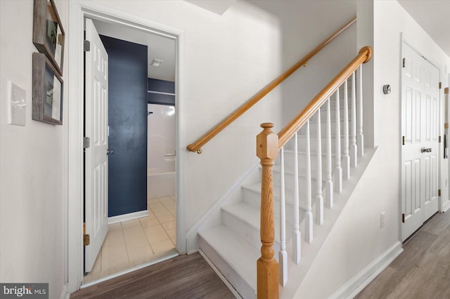 stairway featuring hardwood / wood-style floors