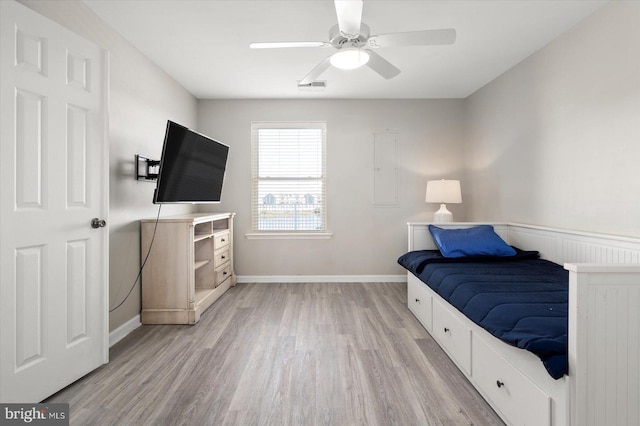 bedroom featuring ceiling fan and light hardwood / wood-style floors