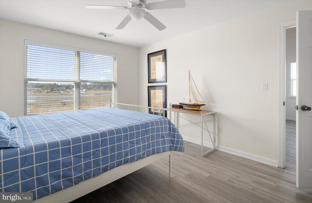 bedroom featuring ceiling fan and hardwood / wood-style floors