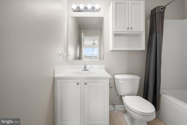 full bathroom featuring tile patterned flooring, shower / bath combo with shower curtain, vanity, and toilet