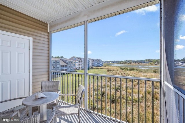 sunroom with a water view