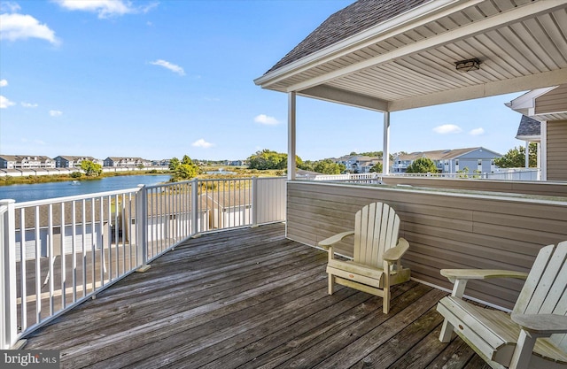 wooden deck with a water view