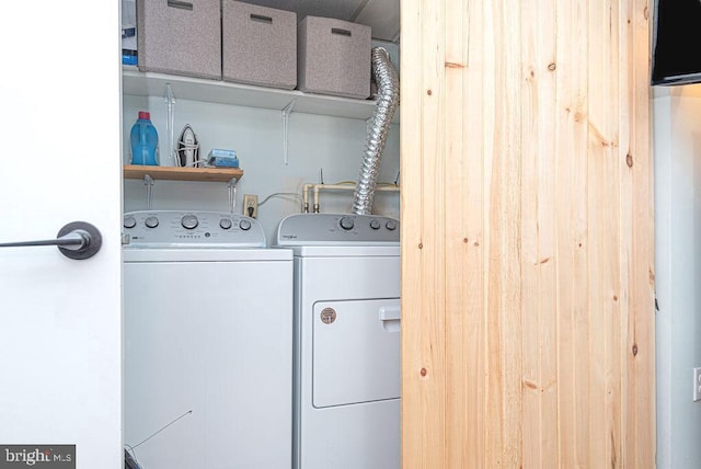 clothes washing area featuring washer and dryer