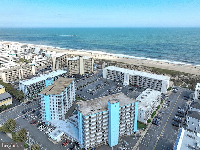 aerial view featuring a water view and a beach view