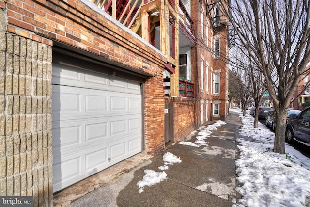 view of snow covered garage