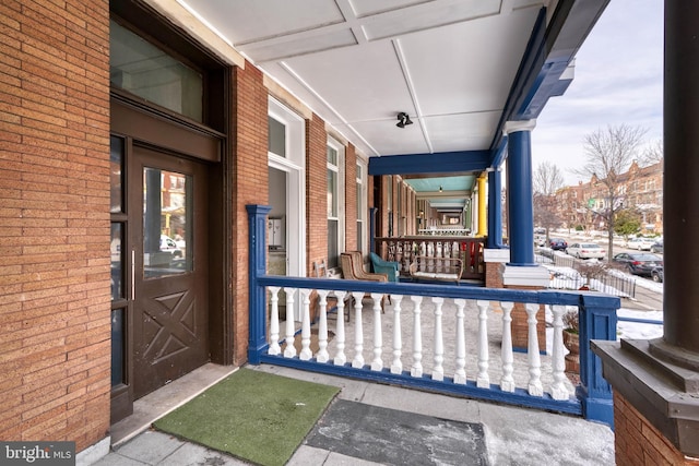 doorway to property featuring a porch