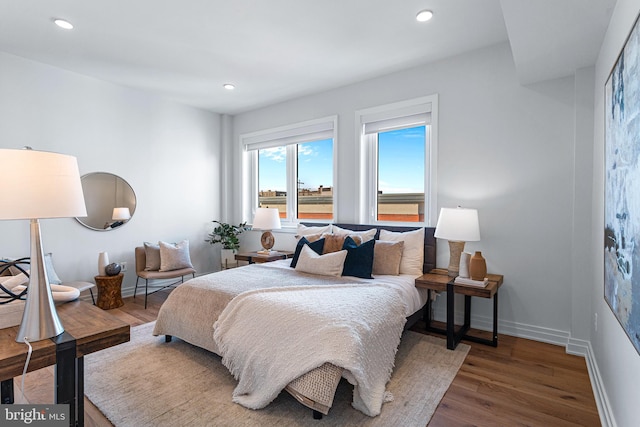 bedroom with dark wood-type flooring