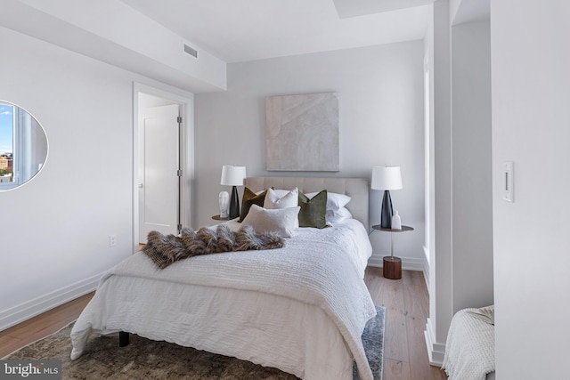 bedroom featuring wood-type flooring