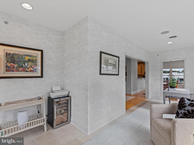 interior space featuring light tile patterned flooring and wine cooler