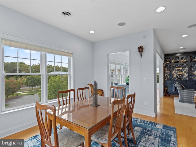 dining space with light wood-type flooring