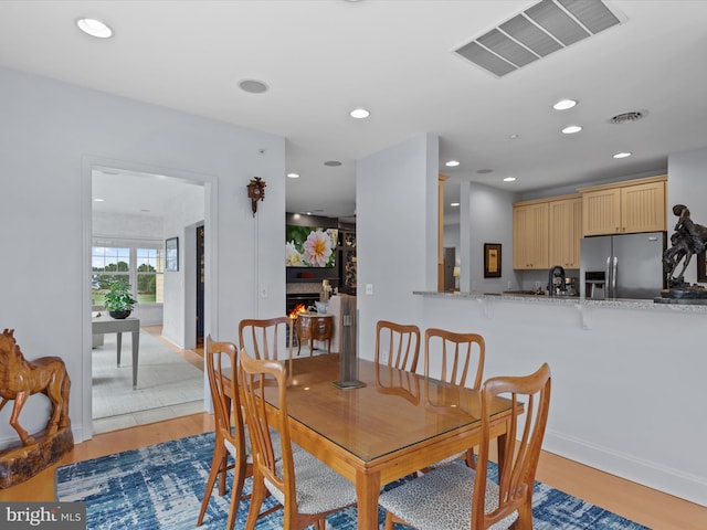 dining space with dark hardwood / wood-style flooring