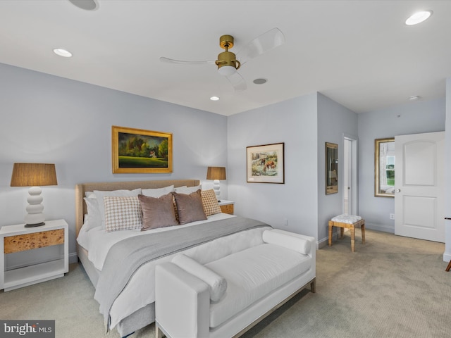 bedroom with ceiling fan and light colored carpet