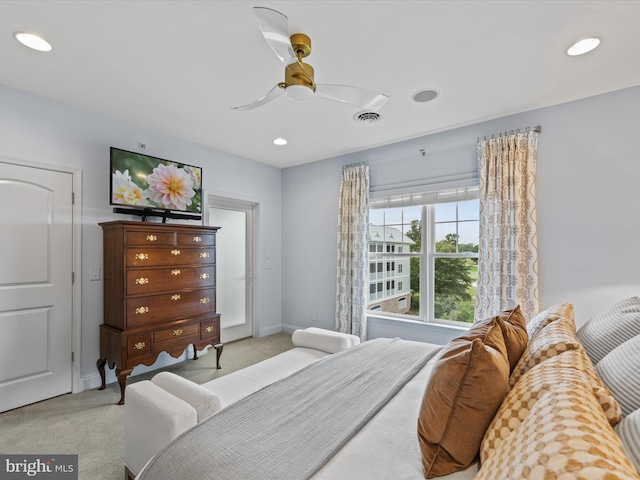 bedroom featuring ceiling fan and light colored carpet