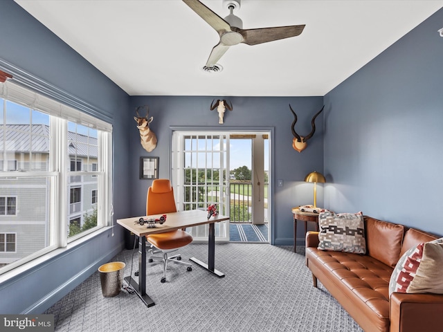 office with carpet and ceiling fan