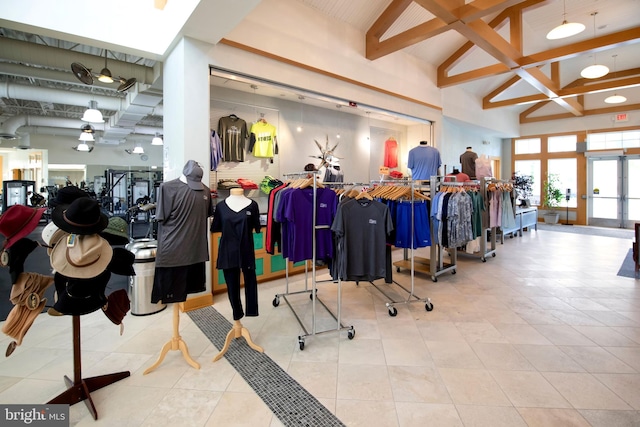 interior space with lofted ceiling and light tile patterned floors